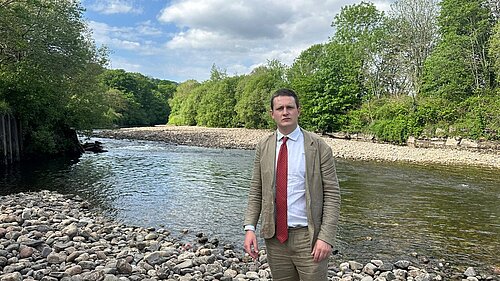 David Chadwick MP infront of River Tawe