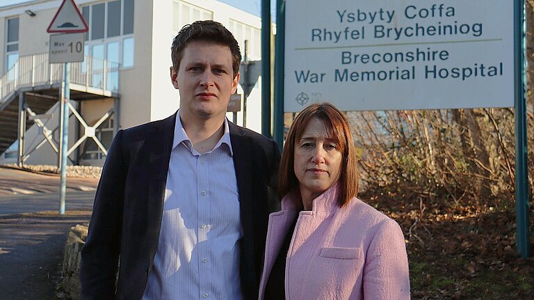 Jane Dodds MS and David Chadwick MP stand outside Brecon Hospital looking dissapointed 