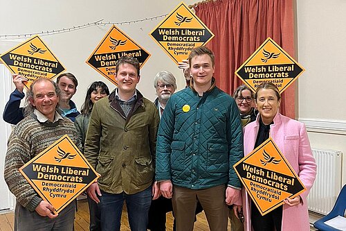 Newley elected Cllr Raiff Devlin celebrating with Jane Dodds MS, David Chadwick and others